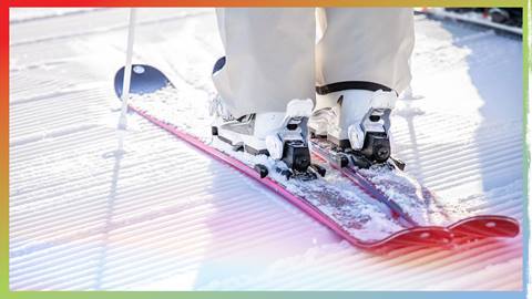 Shot of skier skis, boots, and poles on fresh corduroy