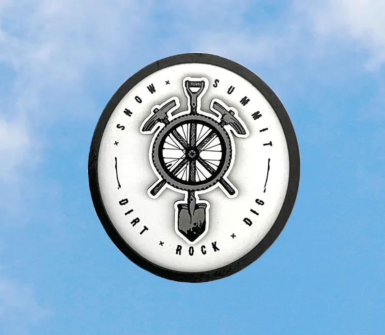 Snow summit's bike park digger logo on a magnet, black and white.