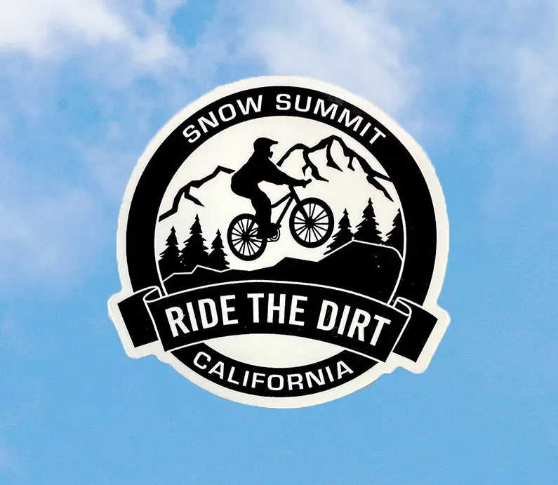 Snow Summit CA Ride the Dirt black and white sticker with a mountain biker on trail lined with trees and mountain design