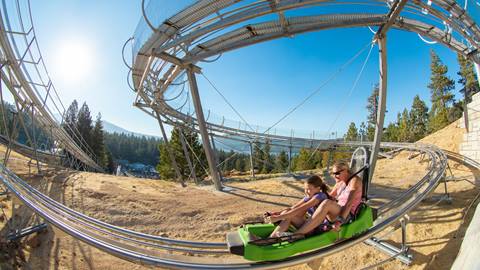 A kiddo and adult on the Alpine Slide at Magic Mountain in Big Bear Lake, CA