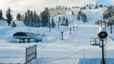 Snow Valley base area and Chair 1 after a snowfall with groomed trails